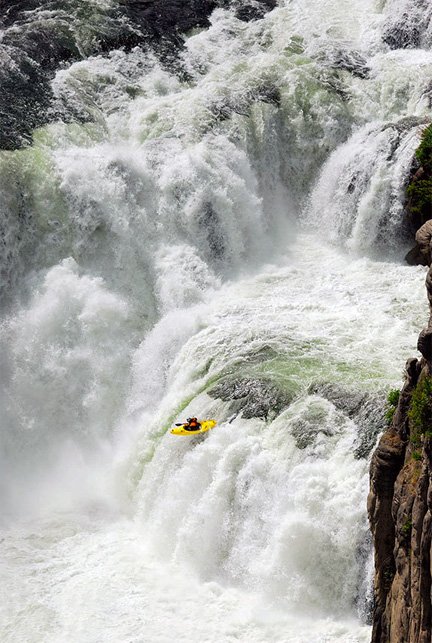 Kayaker Going Over Thunderous Falls